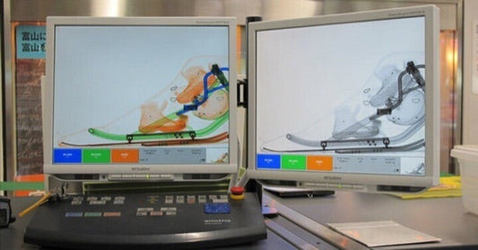 A snowscoot shown on two airport baggage inspection monitors