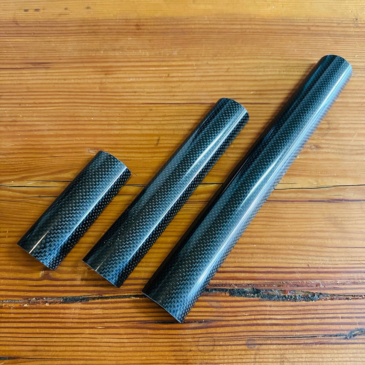 BWS carbon top tube pads in 100 mm, 200 mm and 300 mm lengths, left to right