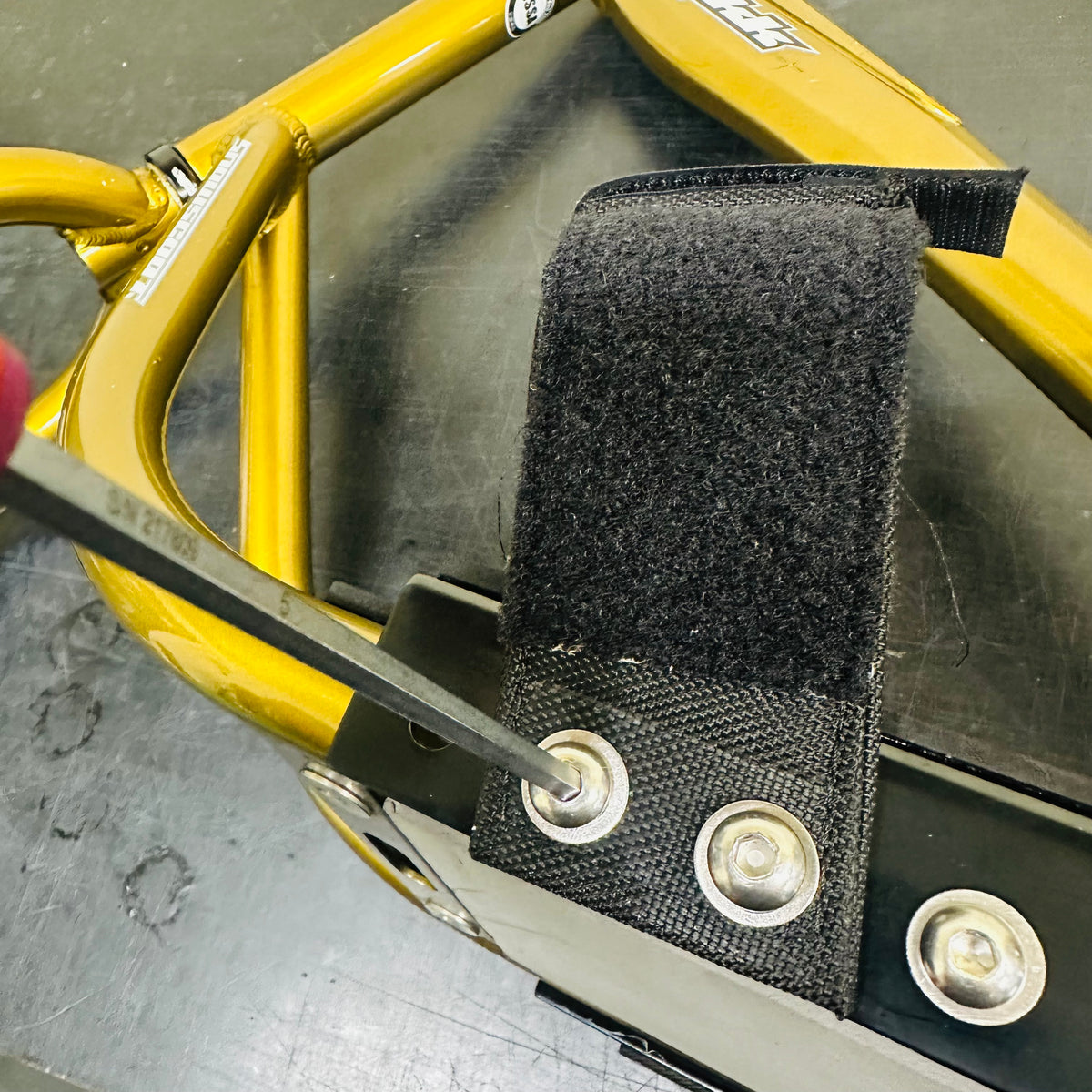Foot strap attachment during service