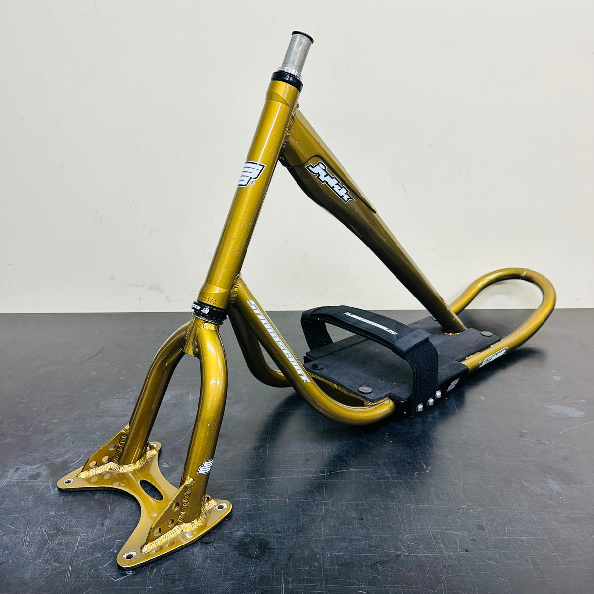 Serviced used JYKK S64 gold frame and fork set, front three-quarter view