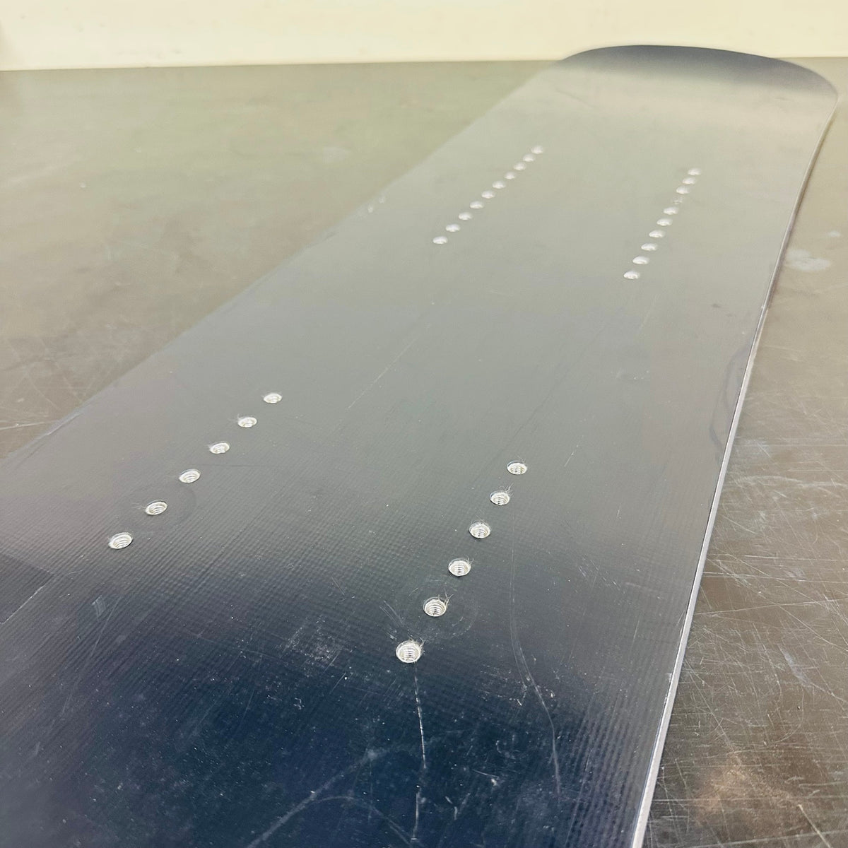 Top sheet scratches and mounting inserts on the used SSST rear board