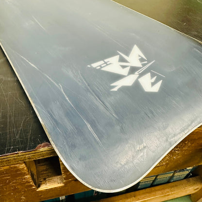 Base and logo close-up showing scratches and wear